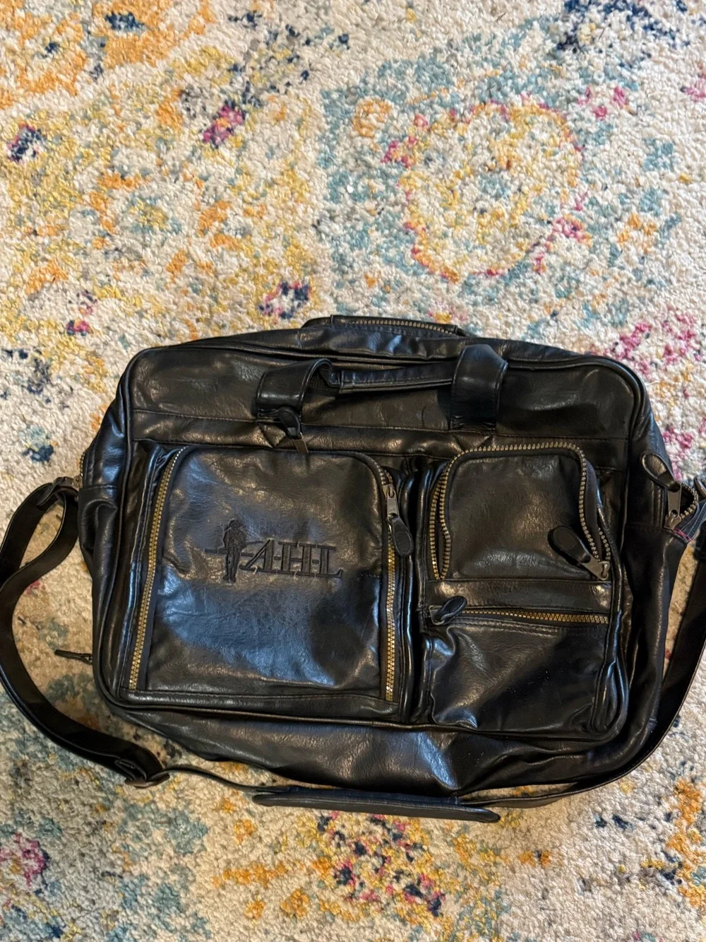 Black Leather Messenger Bag with Front Zip Pockets